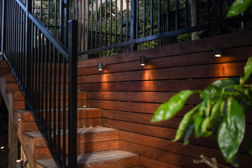 Kwila decking, outdoor up down lights and aluminium balustrade in the heart of Remuera
